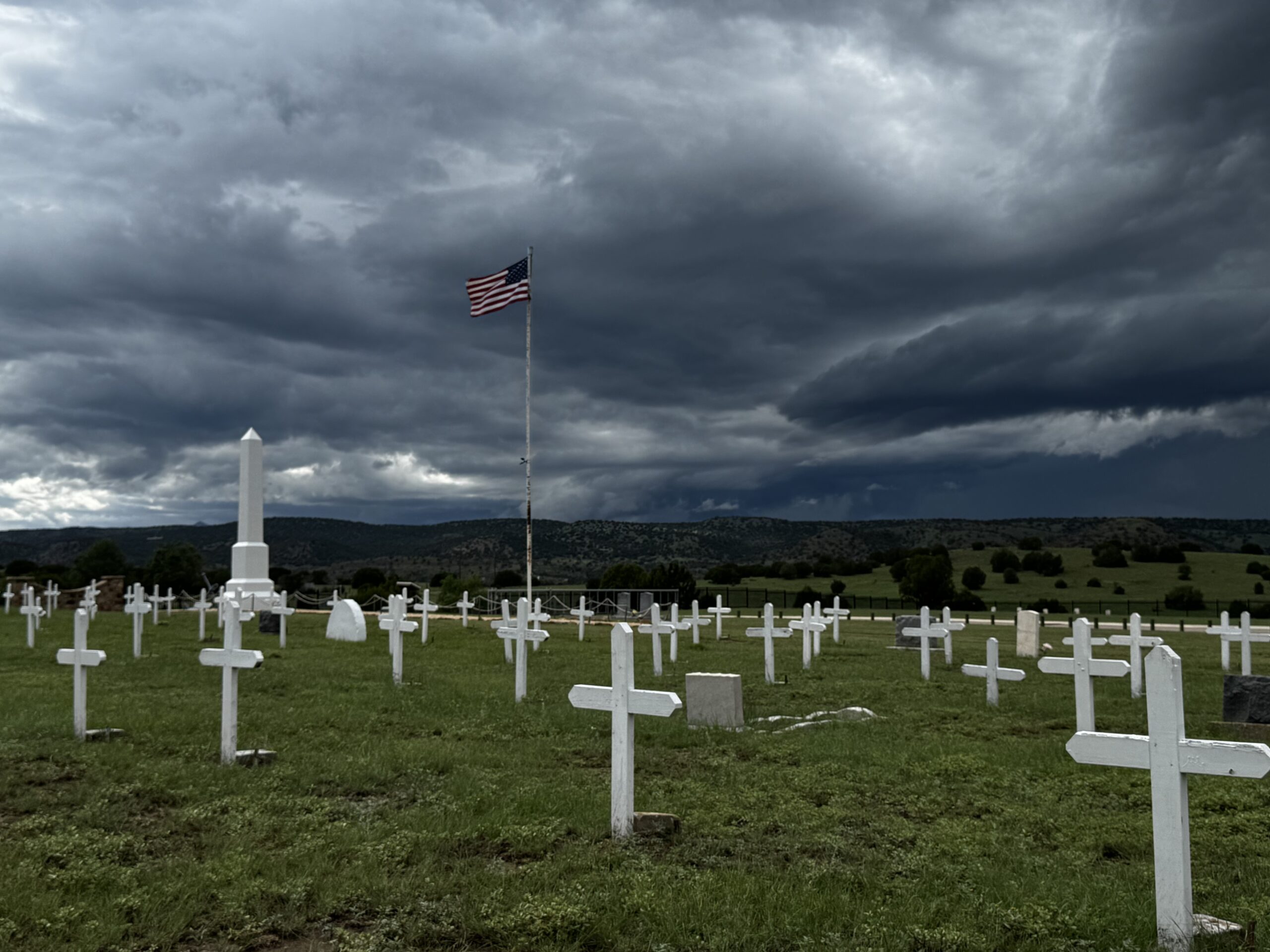 View of the graveyard in front of a hill.